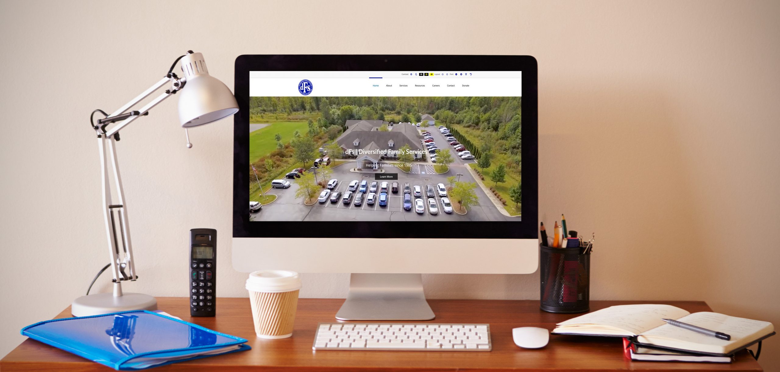 Computer on a desk showing Diversified family services website